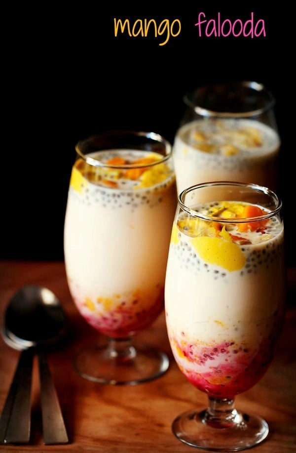 mango falooda served in three glasses with spoons kept on the side.