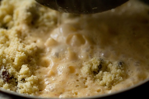 Add the boiling milk to the rava mixture. 