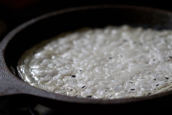 neer dosa after cooking - it is still pale white, but looks lacy and has separated from the tawa