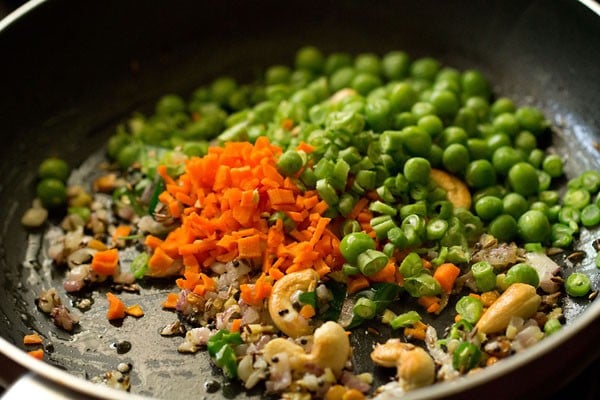 peas, carrots and green beans added in saucepan