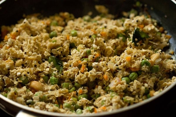 oat and vegetable mixture cooking in saucepan