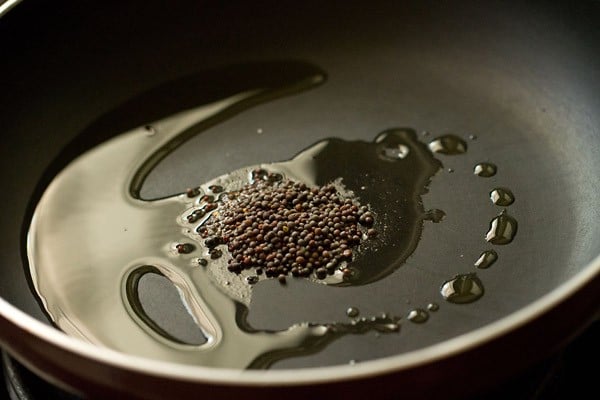 mustard seeds and oil in saucepan
