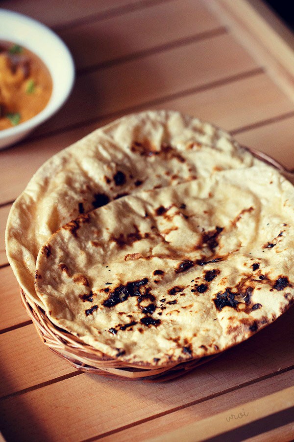 Punjabi tandoori roti on a basket in the sunlight.