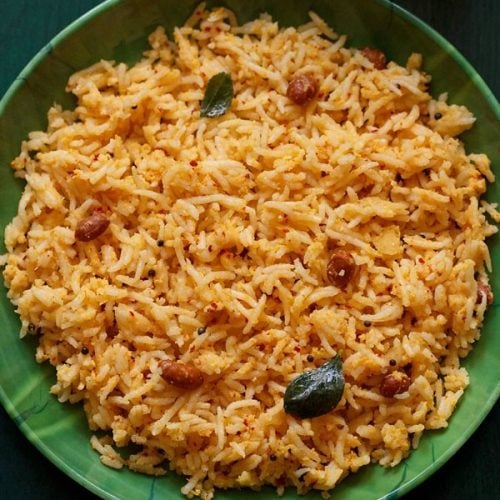 mango rice served in a green plate.