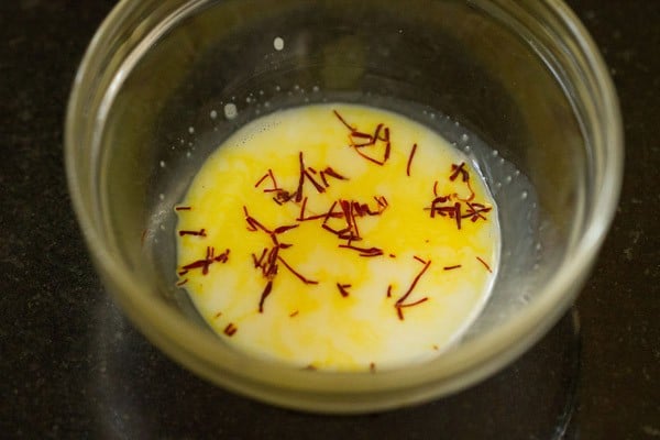 warm milk with saffron threads for shrikhand recipe