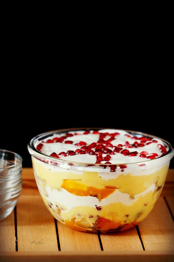 trifle pudding assembled in a transparent glass bowl