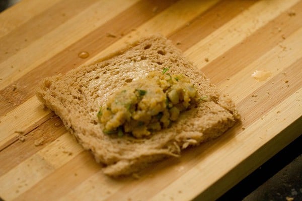 edges of the bread slice moistened with water. 