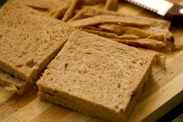 slicing edges from bread slices. 