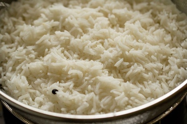 drain the cooked rice in a colander