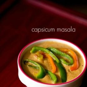 capsicum curry in a dark pink rimmed white bowl topped with colorful capsicum on a red board with text layovers