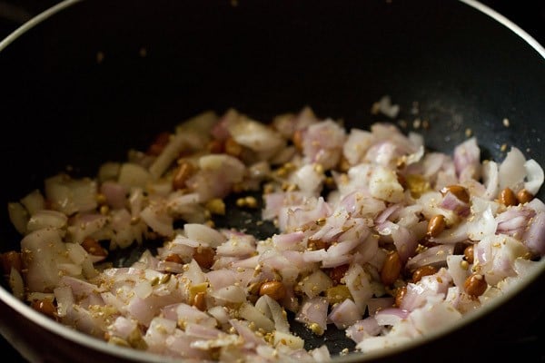 Stirred ginger, onions, peanuts, sesame seeds, coriander seeds and poppy seeds