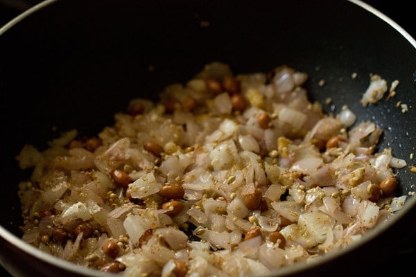 Stirred ginger, onions, peanuts, sesame seeds, coriander seeds, poppy seeds and salt