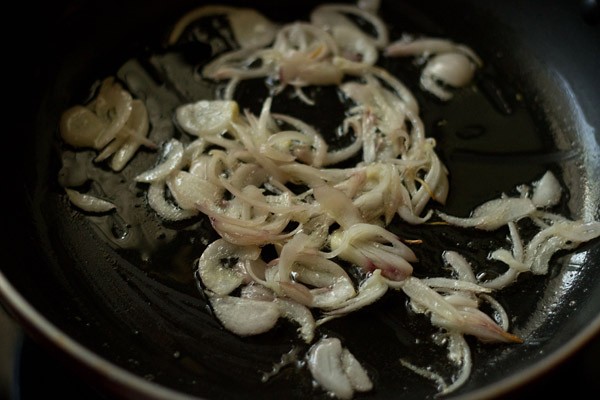 onions being sautéed in oil