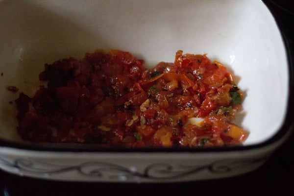 half a portion of the tomato-herb sauce for first layer in a dish