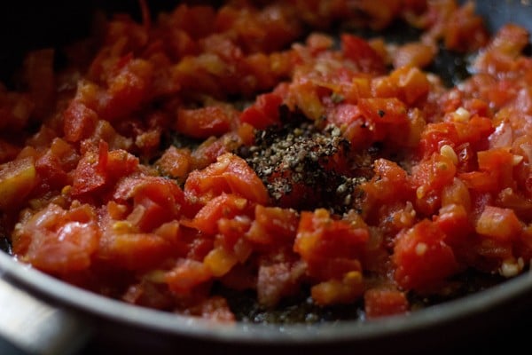 wine, salt, pepper and chopped tomatoes sautéed