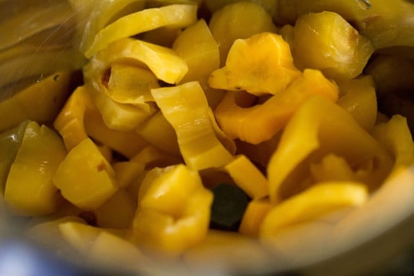chopped ripe jackfruit added to blender jar for making jackfruit milkshake. 