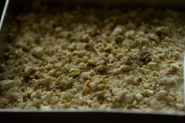 dry fruits and nuts added to top of indian milk cake