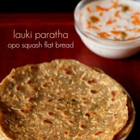 lauki ka paratha served on a plate with a side of carrot raita and text layover.