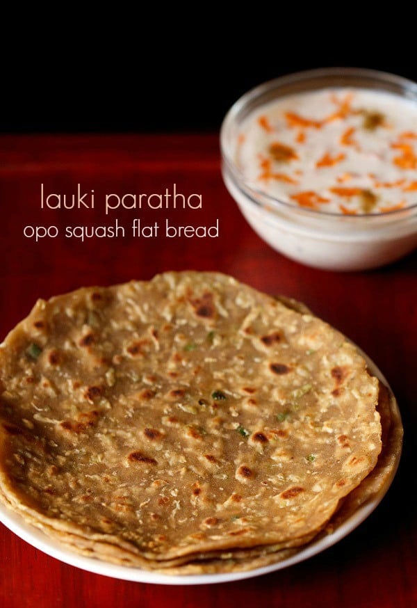 lauki ka paratha served on a plate with a side of carrot raita and text layover.