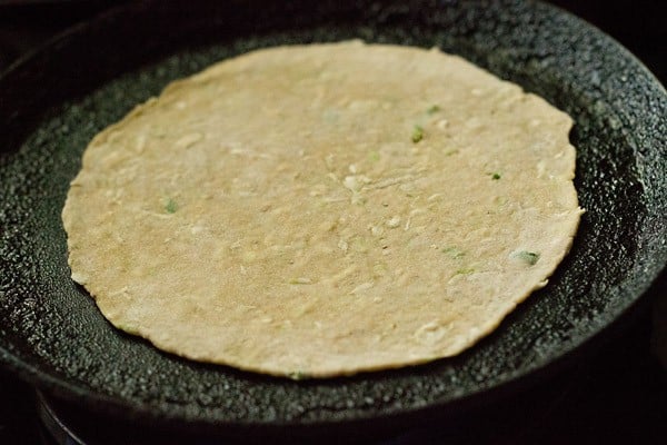 lauki paratha placed on hot tawa