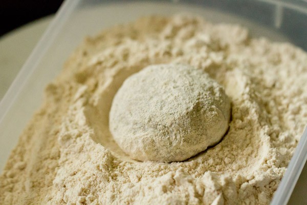 dough ball placed on whole wheat flour