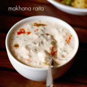 makhana raita served in a white bowl with a spoon in it and text layover.