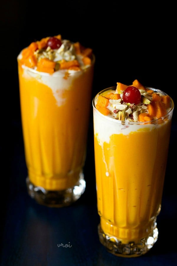 mango mastani served in tall glasses. 