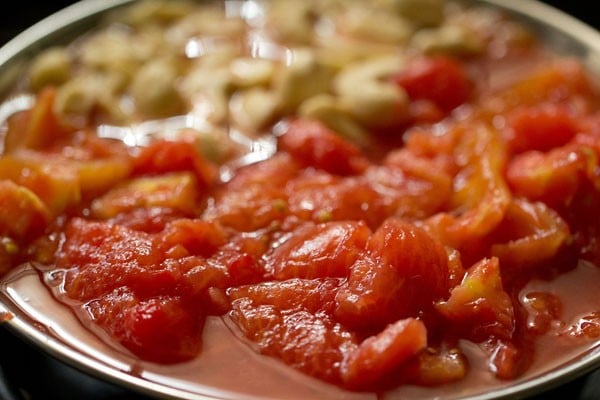 chopping blanched tomatoes 