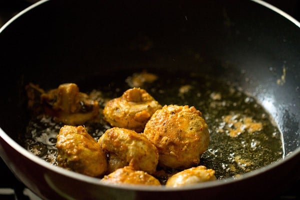 sauteing mushrooms on low heat in the pan