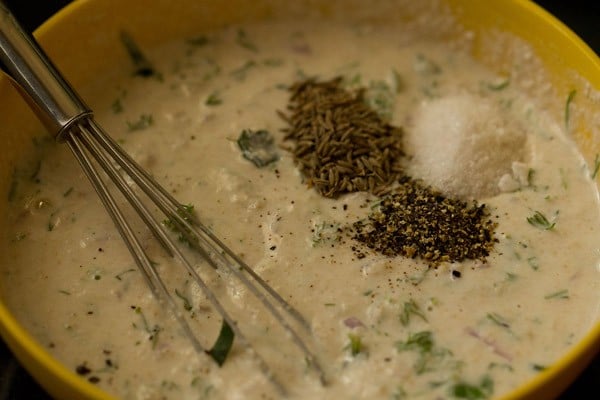 cumin, black pepper, salt and grated coconut in oats dosa batter