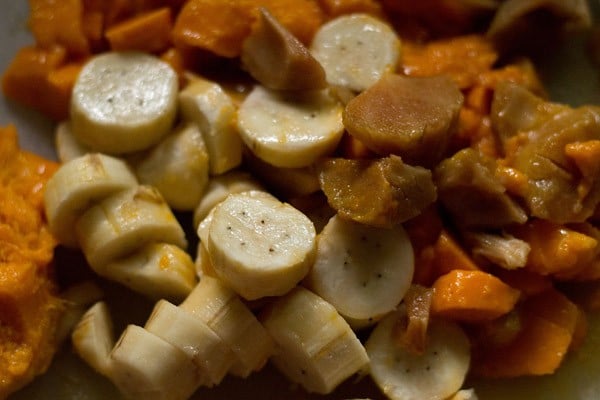 mixed chopped fruits in a blender for making an oats smoothie.