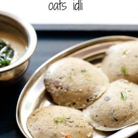 Top shot of four round oats idli arranged on silver plate with coconut chutney in a silver bowl.