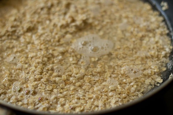 water and oats in pan.
