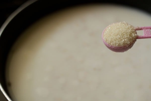 adding sugar to the pan.