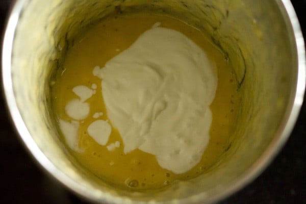 coconut milk on top of pineapple puree in blender.