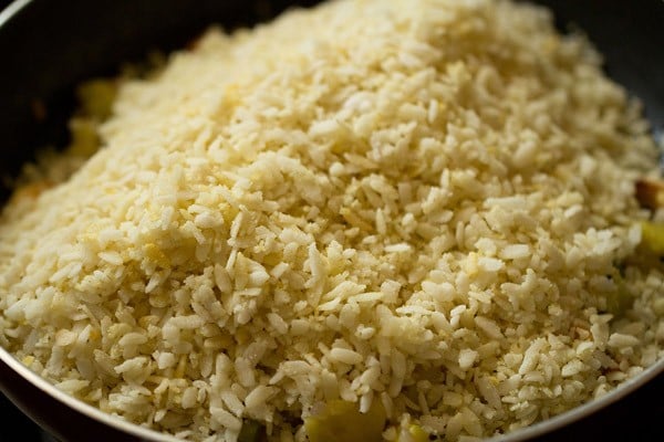 prepared poha mixture added to the pan. 