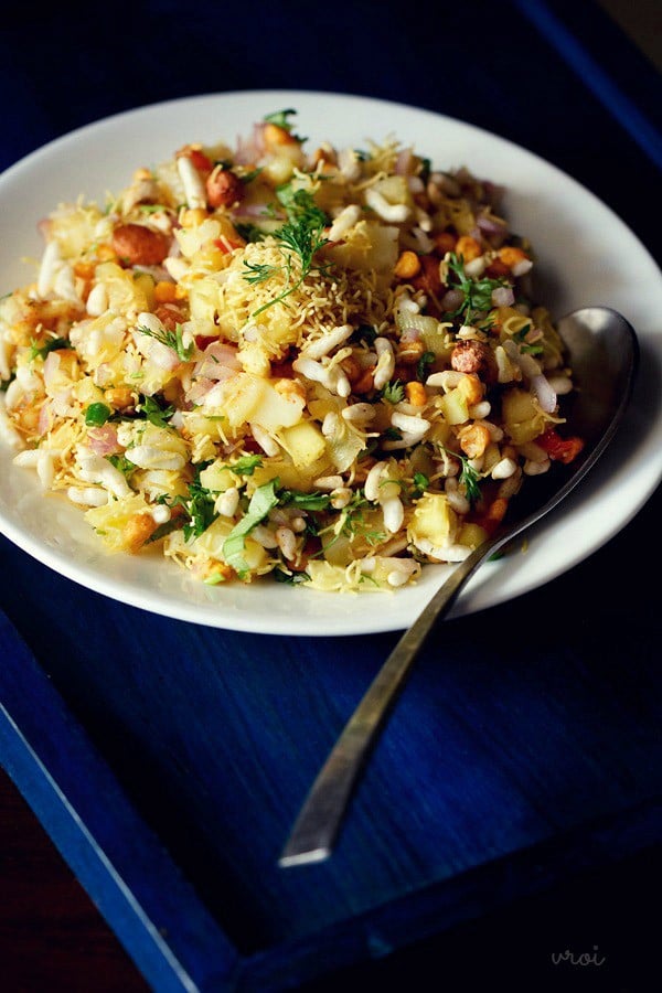 mango chaat served on a plate with a spoon.