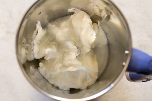 fresh curd added in a blender jar. 