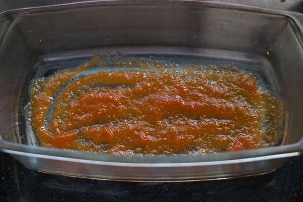 tomato puree in bottom of loaf pan.