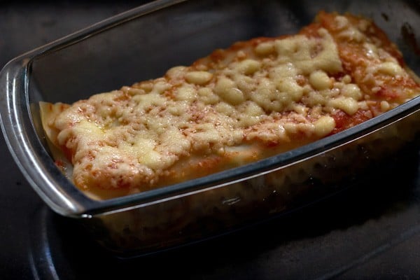 baking spinach mushroom lasagna until cheese is golden.