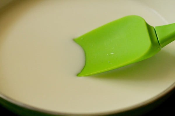 full cream milk added in a pan.