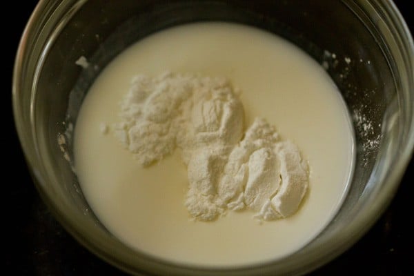 milk and cornstarch added to a bowl.
