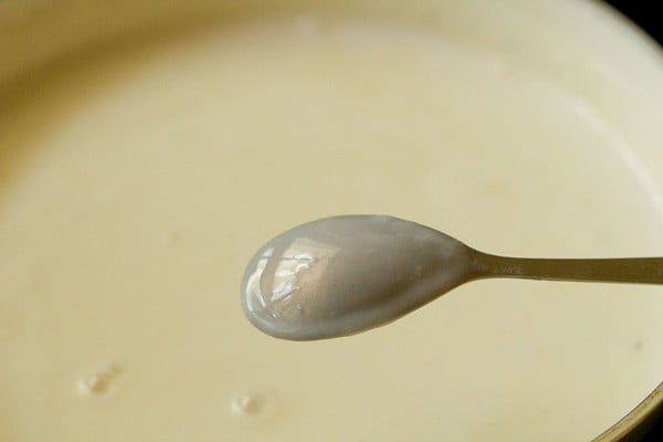 custard sauce coating the back of the spoon.