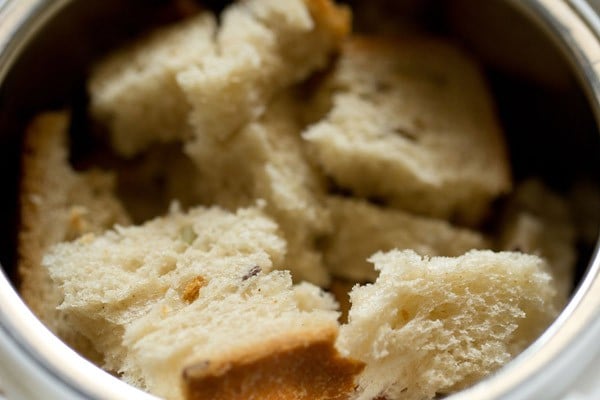 torn bread cubes in a blender