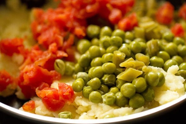 chopped carrots, beans and steamed green peas added to mashed potatoes