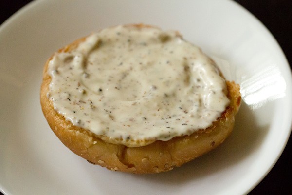 mayonnaise dressing spread on burger bun