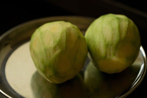 peeled raw mangoes for aam chunda. 