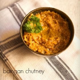 brinjal chutney garnished with coriander leaves and served in a ceramic bowl with text layover.
