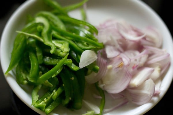 sliced capsicum onions on a plate for bell pepper rice.