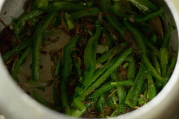 stir capsicum with caramelized onions and spices